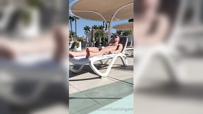 Basitan Gate shows off his body by the pool