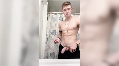 fit guy jerks his huge dick in the bathroom
