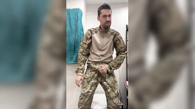 Military guy two hand jeks his meat